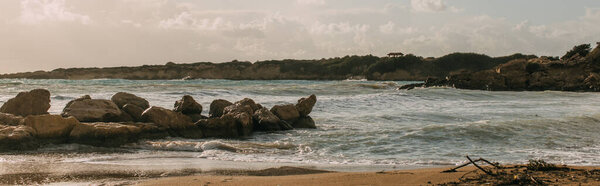 panoramic shot of rocks near mediterranean sea 