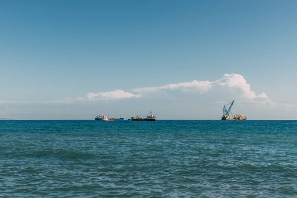 ships in blue mediterranean sea against blue sky 