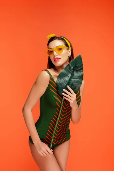 Woman Leaf Looking Camera Isolated Orange — Stock Photo, Image