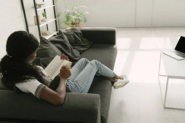 High Angle View African American Freelancer Resting Sofa While Reading — Stock Photo, Image