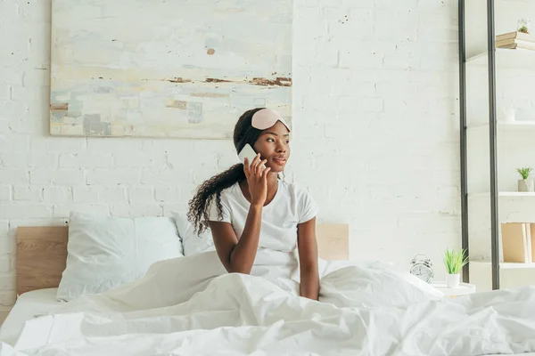 Thoughtful African American Girl Sleep Mask Forehead Talking Smartphone While — Stock Photo, Image