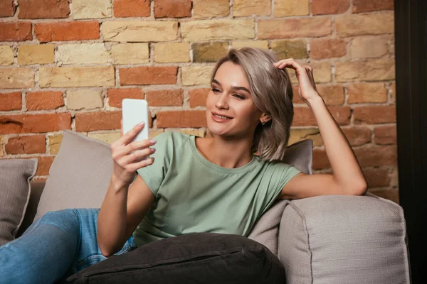 Happy Young Woman Touching Hair Video Call Smartphone — Stock Photo, Image