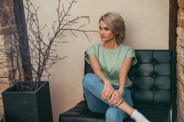 Attractive Young Woman Looking Away While Sitting Armchair Home — Stock Photo, Image