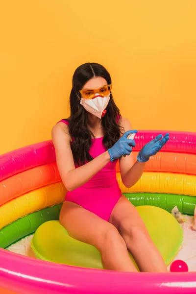 Young Woman Swimsuit Sunglasses Latex Gloves Medical Mask Sitting Inflatable — Stock Photo, Image