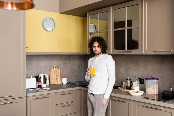 Sad Man Pajamas Looking Camera While Holding Glass Orange Juice — Stock Photo, Image