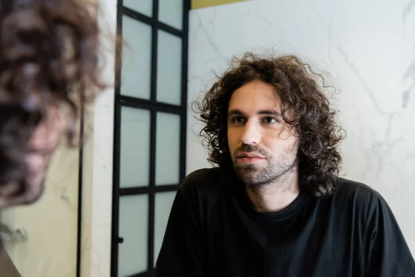 Selective Focus Handsome Curly Man Looking Mirror Bathroom — Stock Photo, Image