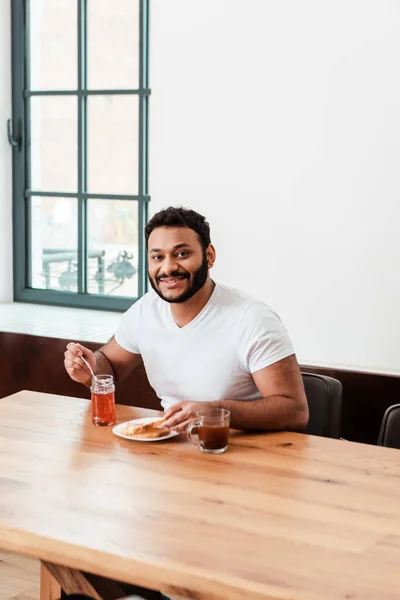 Smiling African American Man Holding Spoon Sweet Jam Toast Bread — Stock Photo, Image