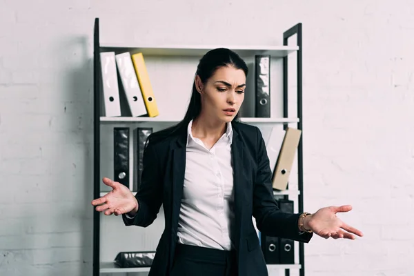 Portrait of stressed businesswoman standing in office — Stock Photo