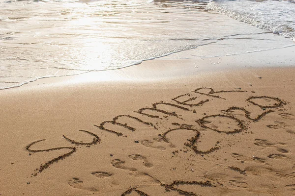 Beach with summer 2020 lettering on sand near sea — Stock Photo