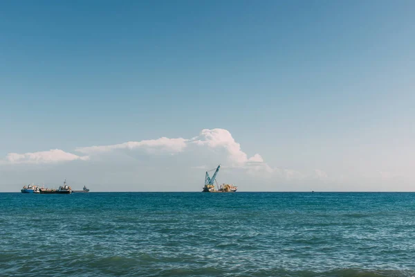 Ships in blue mediterranean sea against blue sky with clouds — Stock Photo