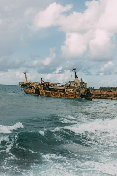 Weathered ship in blue water of mediterranean sea — Stock Photo