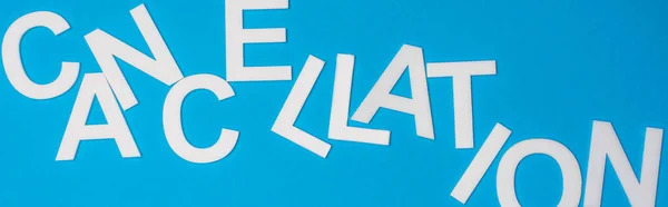 Top view of lettering cancellation isolated on blue, panoramic shot — Stock Photo