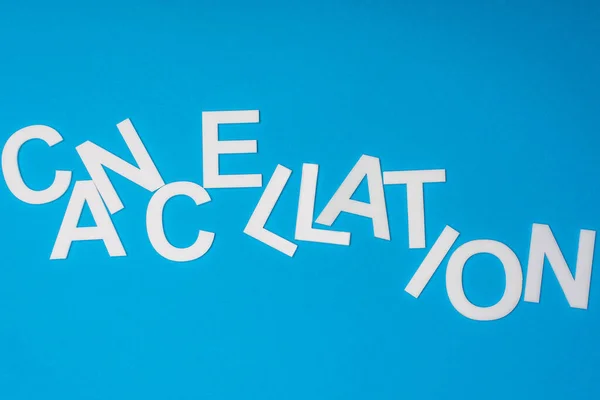 Top view of cancellation lettering isolated on blue — Stock Photo