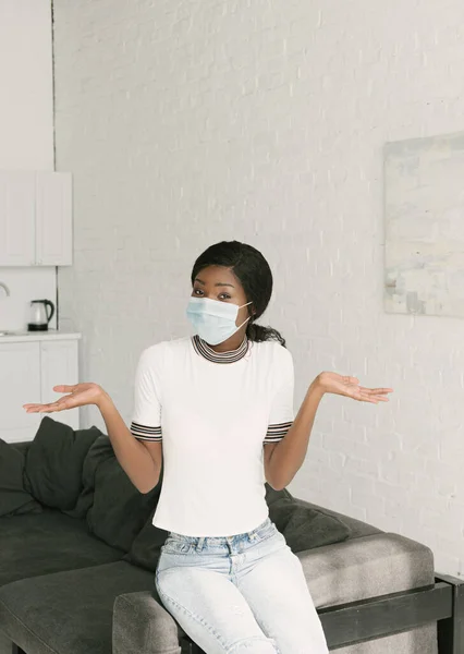 Confused african american girl showing shrug gesture while looking at camera — Stock Photo