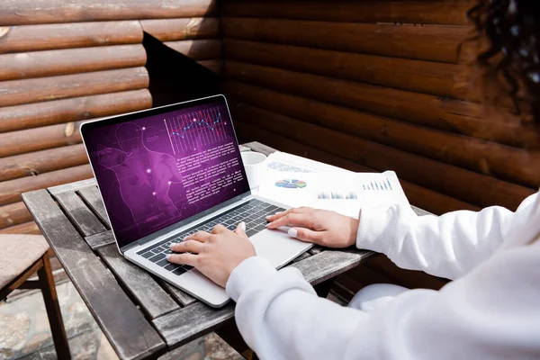 Cropped view of african american freelancer using laptop with medical website — Stock Photo