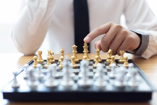 Business men make plans to play chess with Prudence and success, Management or leadership concept.