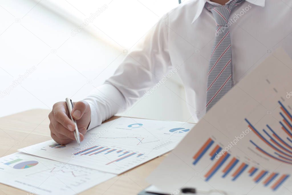 Businessmen use graphs to summarize results and calculate income-expenses to find financial balance points and use them to improve and advance business, finance and economic concepts.