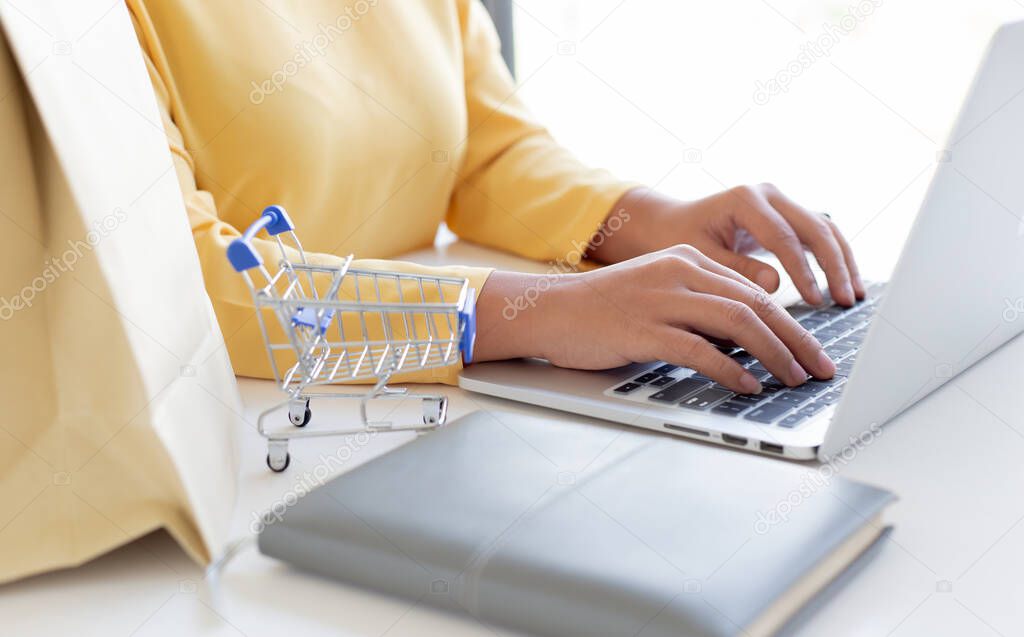 Women use laptop register via credit cards to make online purchases, Online shopping or Internet technology concept.