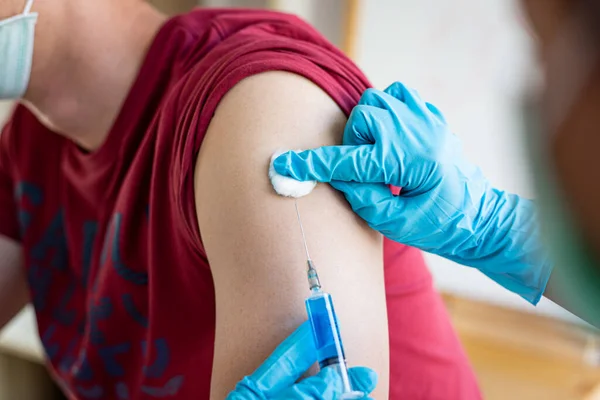 Doctors are vaccinating a new strain of flu patients to prevent the spread of the disease and the epidemic in all ages, Vaccination against communicable diseases concept