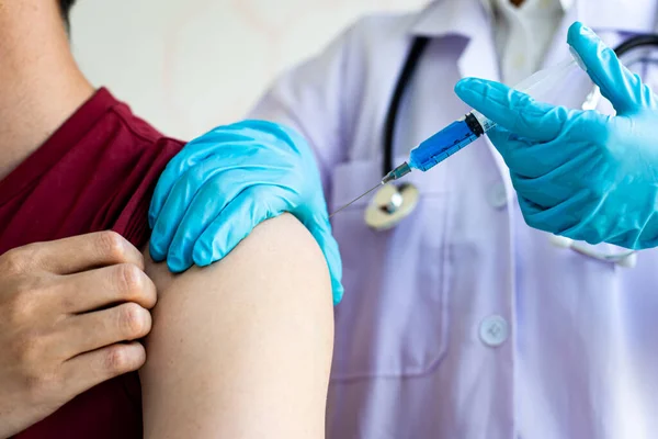 Doctors are vaccinating a new strain of flu patients to prevent the spread of the disease and the epidemic in all ages, Vaccination against communicable diseases concept
