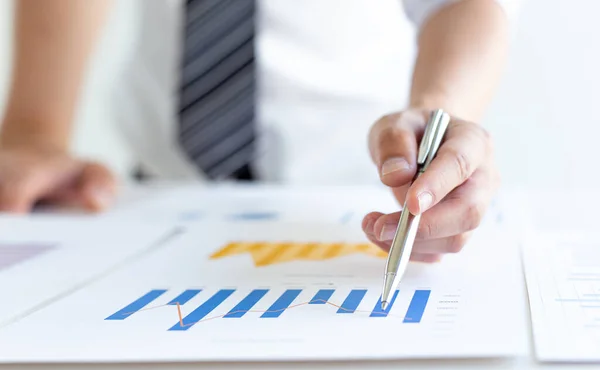 stock image Business men analyze financial graphs and find break-even points for investments in order to reduce costs and reduce corporate taxes, Analysis of financial accounting and real estate investment concept.