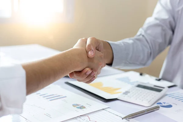 Greeting and meeting, business partners as partners shaking hands to congratulate each other to work together, Building friendship in real estate investment , handshake concept.