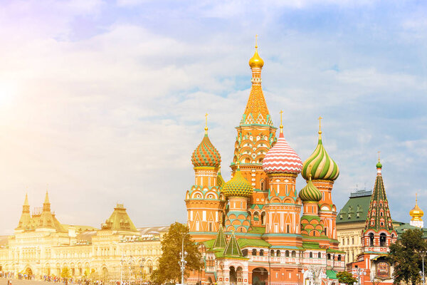 Saint Basil's Cathedral in Moscow with main department store (GUM) on the background