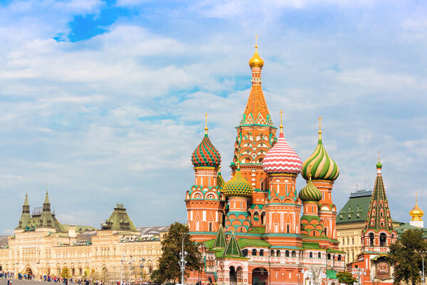 Saint Basil's Cathedral in Moscow with main department store (GUM) on the background