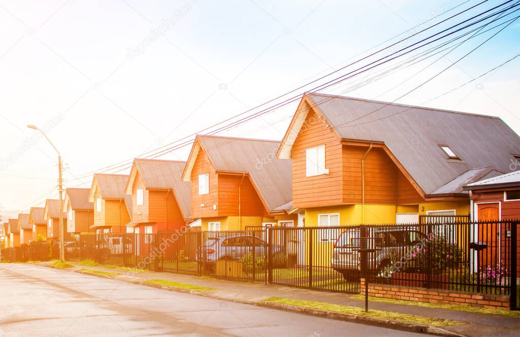 Similiar houses after rain in Valdivia at sunset, Chile