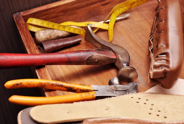 Shoemaker tools. Shoemaker workshop. The hammer of a shoemaker. Hammer shoemaking.
