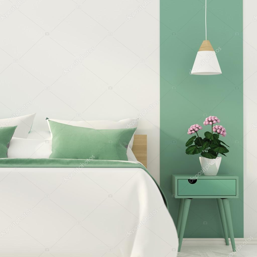 Stylish bedroom with green decoration
