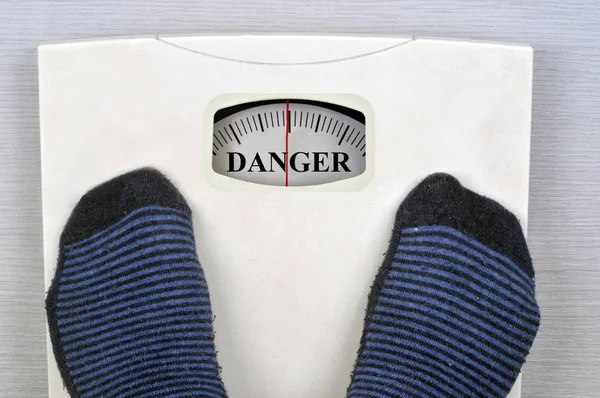 Someone Scale Displaying Word Danger — Stock Photo, Image