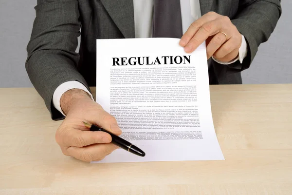 Man Presenting Regulation Sheet Paper — Stock Photo, Image