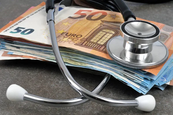 Stethoscope with euro bank notes close up