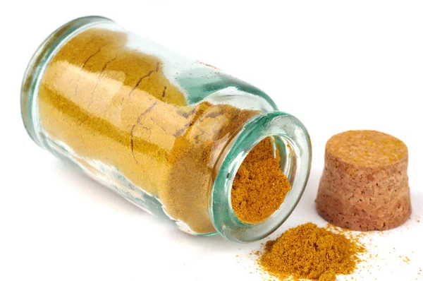 Bottle Spilled Curry Powder Close White Background — Stok fotoğraf