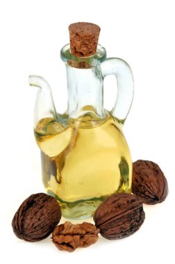 Carafe of walnut oil close-up on white background 