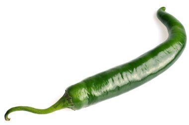 Green chili pepper in half close-up on white background 
