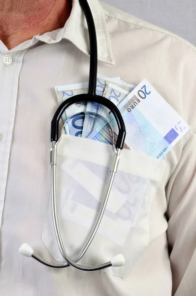 Doctor with euro banknotes in his shirt pocket