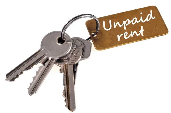 Bunch Keys Key Ring Which Written Unpaid Rent Close White — Stock Photo, Image