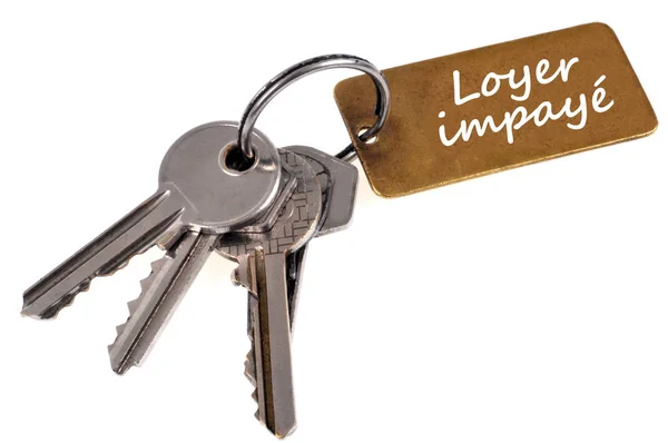Bunch Keys Key Ring Which Written Unpaid Rent French Close — Stock Photo, Image
