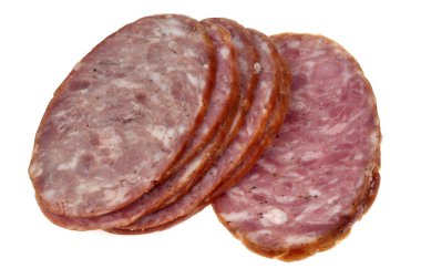 Garlic sausage slices close up on white background