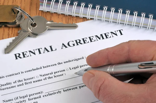 Complete a rental contract in english with a close-up pen