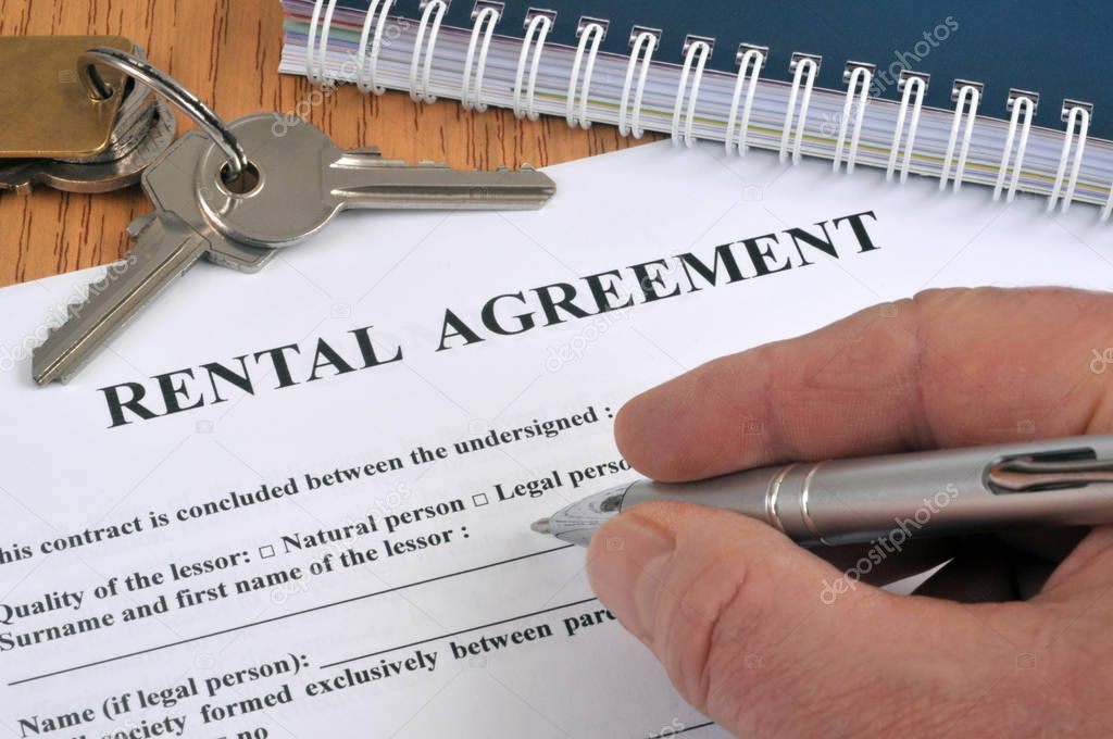 Complete a rental contract in english with a close-up pen 