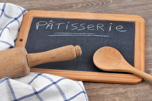 Pastry written on a school slate with chalk