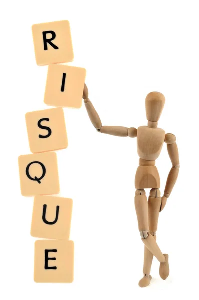 Risk Concept Mannequin Holding Letters Alphabet Imbalance White Background — Stockfoto