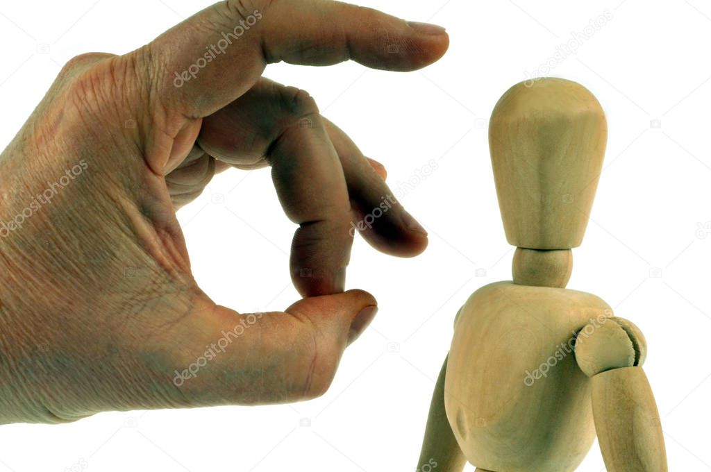 Termination concept with a hand pushing away a wooden mannequin on a white background 