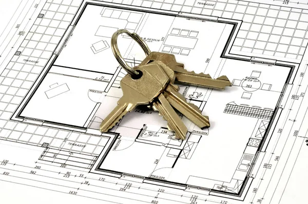 Bunch of keys on a house plan close up