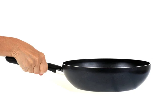一只手拿着平底锅在白底上烤着 — 图库照片