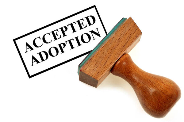 Rubber stamp showing adoption accepted close-up on white background