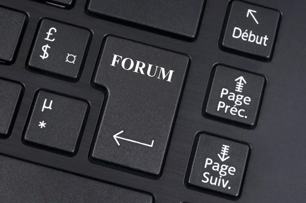 Online forum concept with a computer keyboard close up